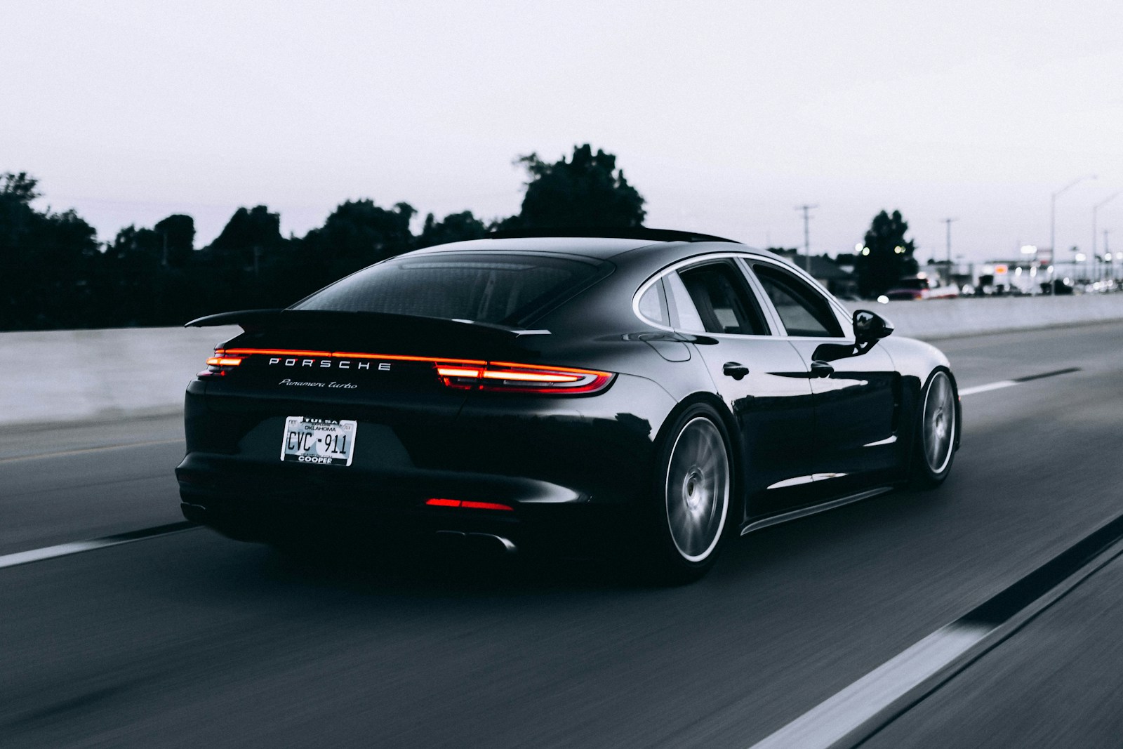 running black Porsche sedan, car, insurance