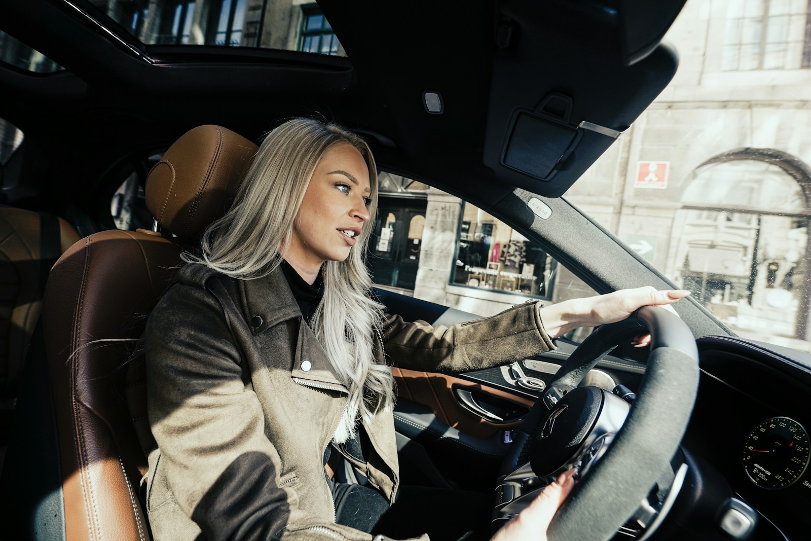 woman in gray coat driving car, motorist, auto